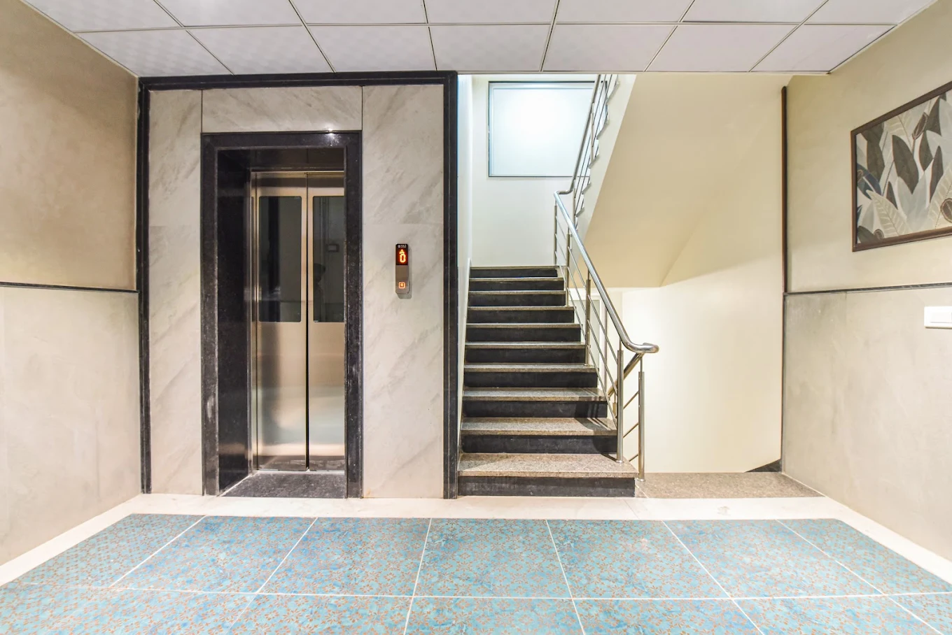 Lift and staircase lobby — photograph from the property’s Google listing